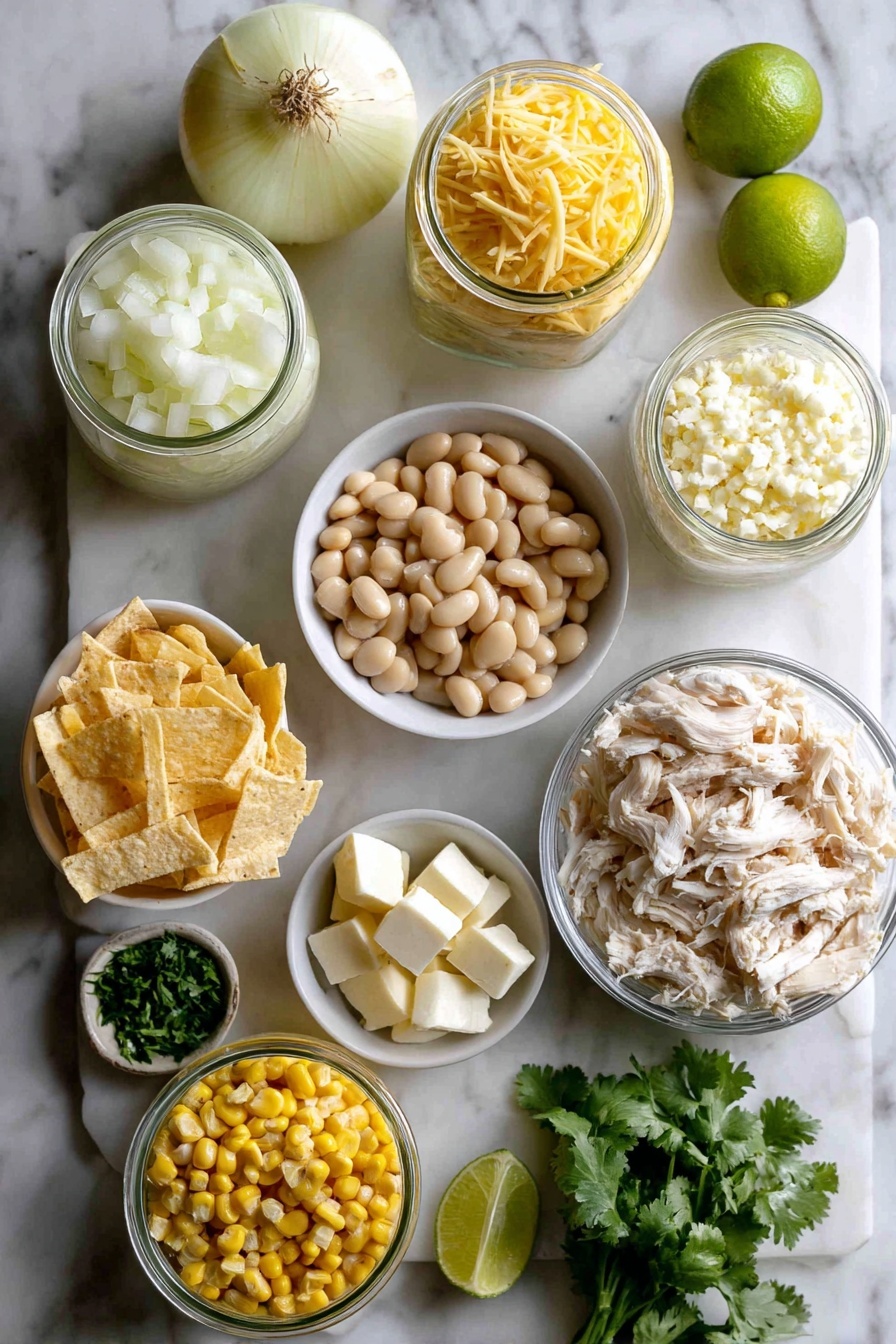 Flat lay of a medium yellow onion diced, two garlic cloves minced, two cans of diced green chiles opened, a small bowl of drained whole kernel corn, two cans of drained white beans, a few cubes of cream cheese, a generous pile of shredded rotisserie chicken, a small bowl of fresh chopped cilantro, a lime wedge, and a selection of toppings including shredded cheese, sliced avocados, sliced jalapenos, and crispy tortilla strips, all placed on a white marble surface, photo taken with an iphone --ar 2:3 --v 7