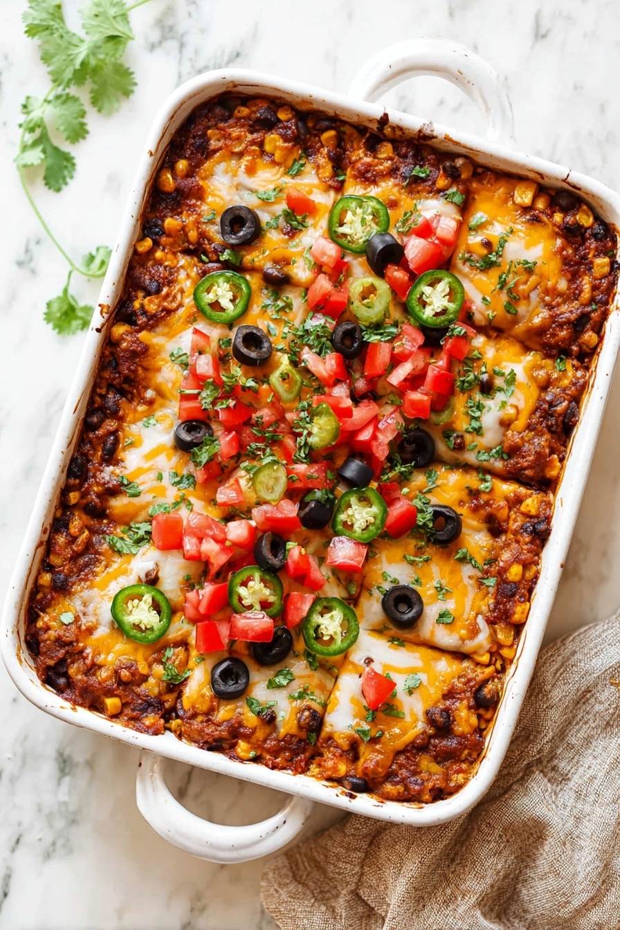 A white rectangular baking dish filled with a layered casserole of melted golden and white cheese mixed with browned ground meat and diced corn and beans, topped in the center with fresh diced red tomatoes, round black olive slices, and bright green jalapeño rings, all sprinkled with finely chopped green herbs. The edges show a crispy, browned crust, and the casserole sits on a white marbled texture surface photo taken with an iphone --ar 2:3 --v 7
