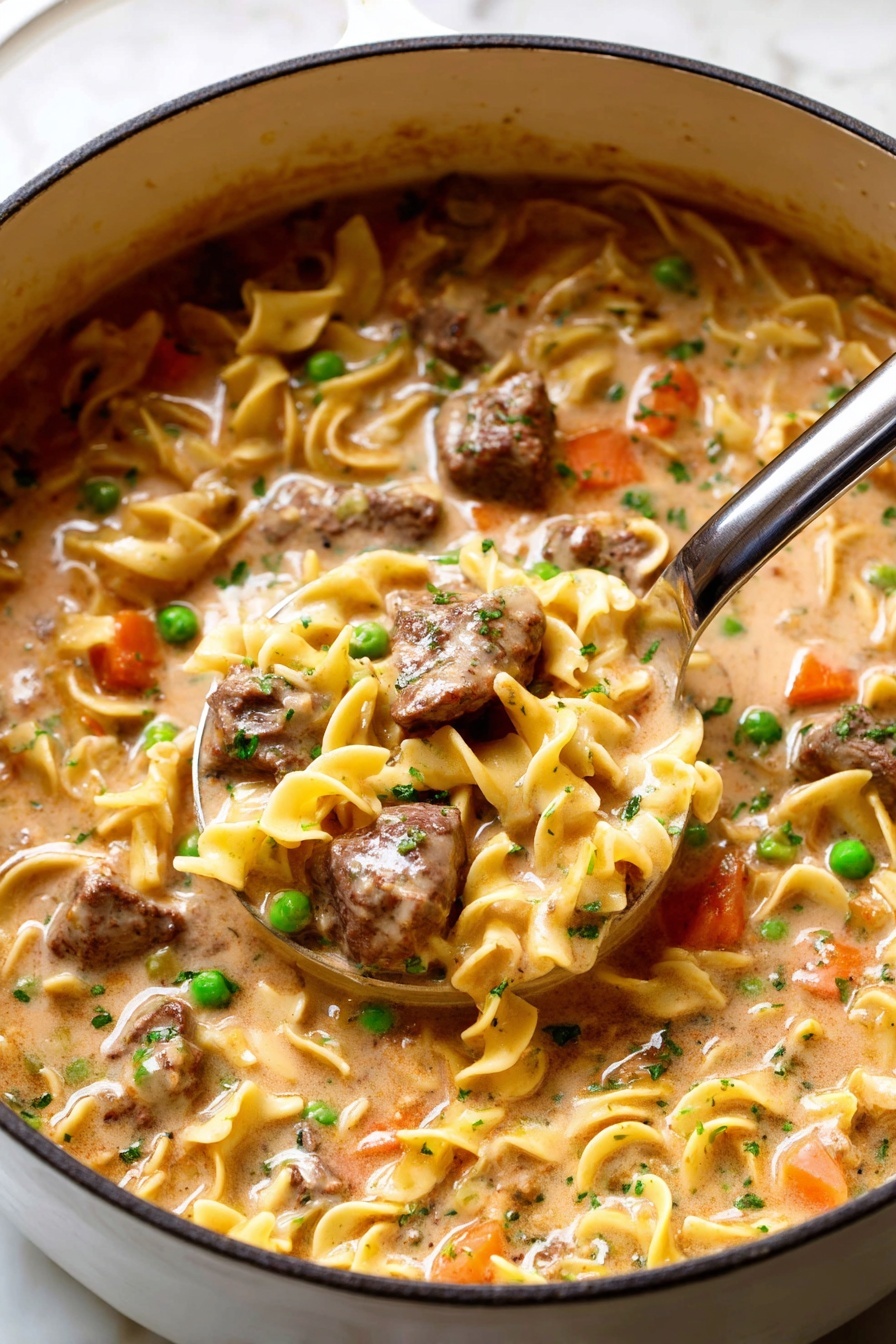 This image shows a creamy stew with three main layers visible inside a white pot. The base layer is a light brown creamy sauce that looks smooth and thick. The middle layer consists of yellow egg noodles that are soft and curly, floating in the sauce. The top layer has chunks of browned meat, bright green peas, and pieces of orange carrot scattered evenly on the surface. The stew is garnished with small green herb bits, adding a fresh touch. A large metal ladle filled with noodles, meat, peas, carrots, and sauce is in the center, slightly lifted above the stew. The photo is taken on a white marbled surface. Photo taken with an iphone --ar 2:3 --v 7