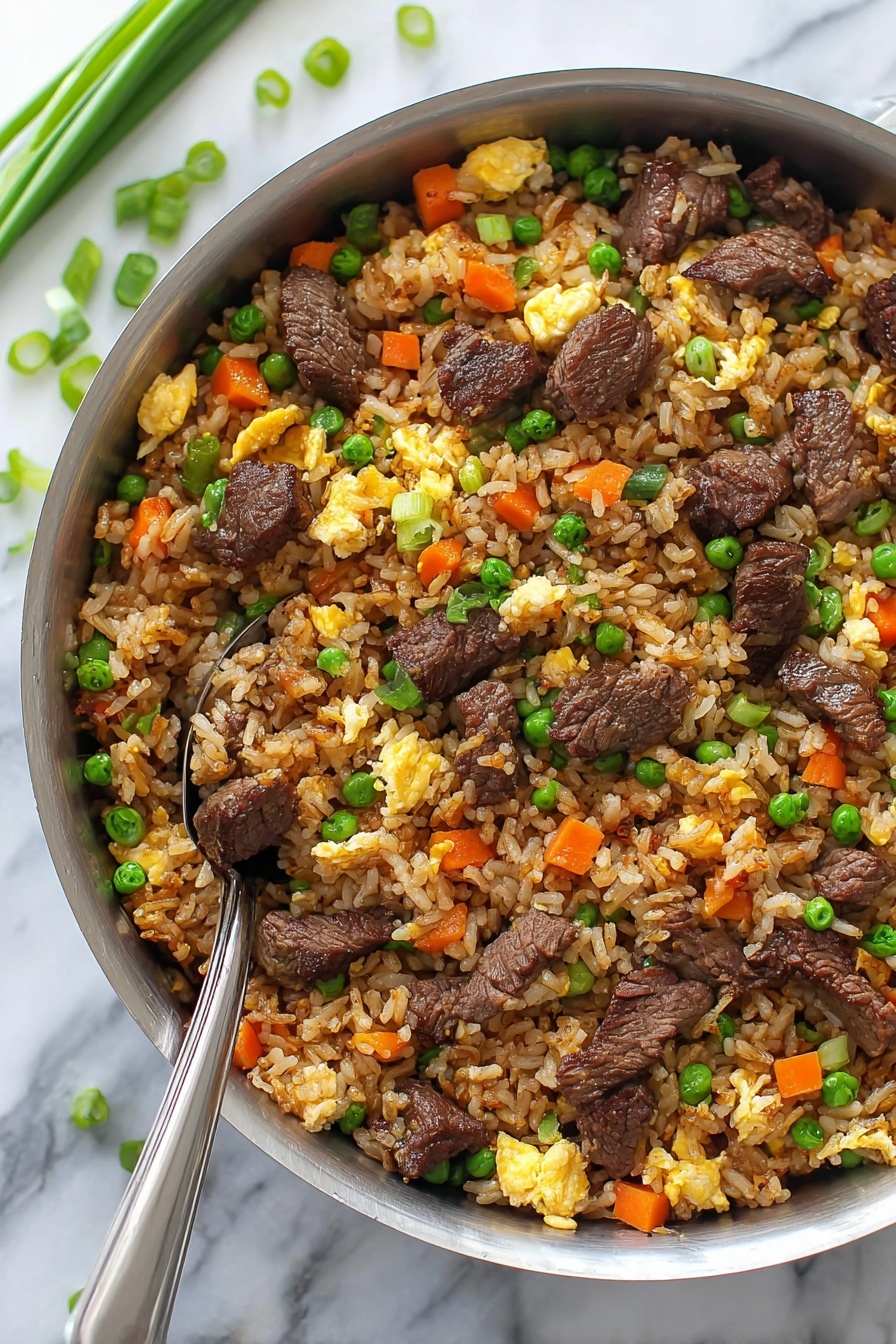 The image shows a shiny silver pan filled with fried rice mixed with several colorful layers: brown rice grains form the main layer with small bright orange carrot cubes, green peas, and light yellow scrambled egg pieces scattered throughout. There are also dark brown, tender chunks of beef evenly spread in the dish, topped off with sprinkled green onion slices. A metal spoon is partially inside the pan, ready to serve, and the background is a smooth white marbled surface with some green onion pieces placed nearby. photo taken with an iphone --ar 2:3 --v 7