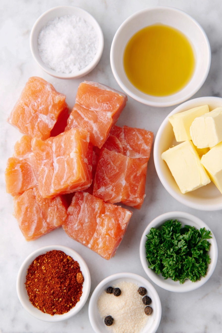 Flat lay of fresh, bite-sized cubes of raw salmon with vibrant pink-orange flesh, a small white ceramic bowl of golden extra virgin olive oil, a neat pile of bright red paprika powder, another small white bowl containing fine white garlic powder, a similar white bowl with light beige onion powder, a small heap of coarse kosher salt crystals, a white bowl with cracked black peppercorns, a few pats of creamy unsalted butter resting directly on the white ceramic surface, a small white bowl filled with glossy amber hot honey, and a handful of freshly chopped bright green parsley leaves arranged in a simple white ceramic bowl, placed on a clean white marble surface, soft natural light, photo taken with an iPhone, professional food photography style, fresh ingredients, white ceramic bowls, no bottles, no duplicates, no utensils, no packaging --ar 2:3 --v 7 --p m7354615311229779997