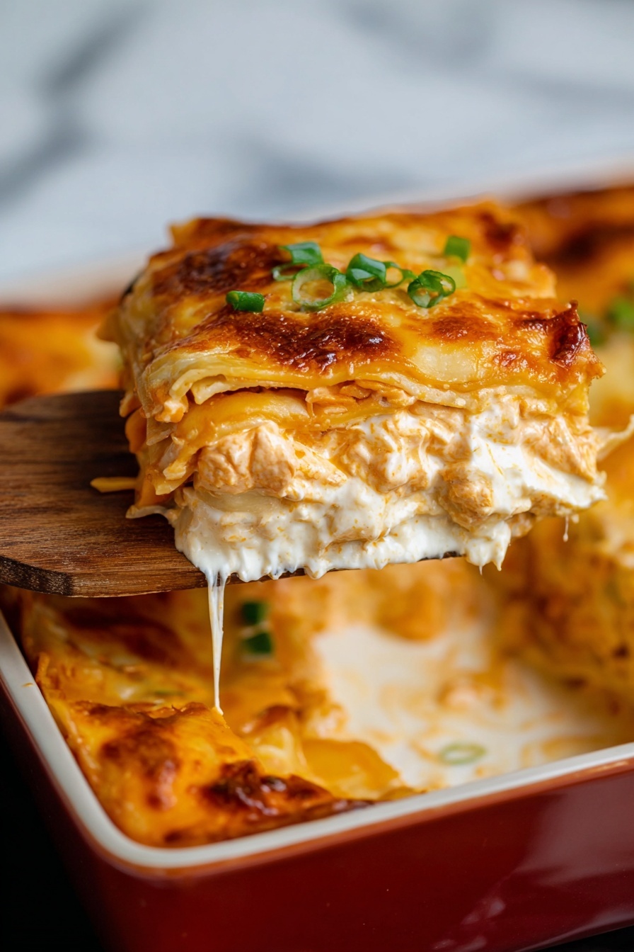 A serving of lasagna is being lifted from a white baking dish by a spoon held with a woman's hand, showing multiple layers: a browned and slightly crispy cheese top layer, a thick creamy white sauce layer beneath it, followed by a dense, orange-colored sauce with small chunks mixed through, then another layer of creamy white sauce with pasta sheets visible in between; small pieces of green onion garnish are on top of the cheese layer. The dish rests on a white marbled surface, with a white plate partially visible nearby. Photo taken with an iphone --ar 2:3 --v 7